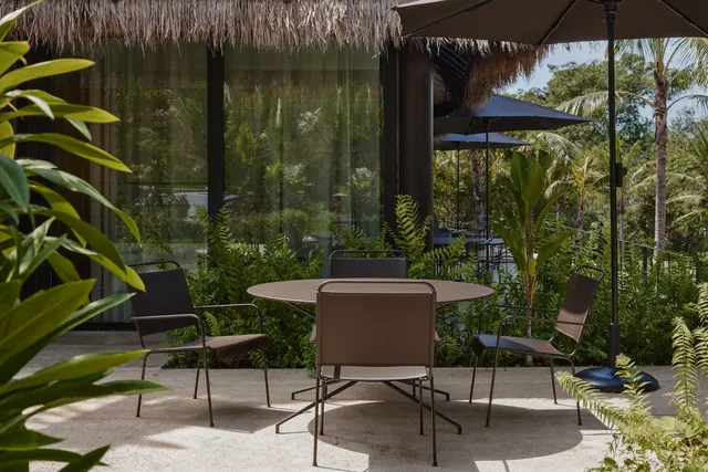 Restored metal garden furniture set on a Bali villa terrace
